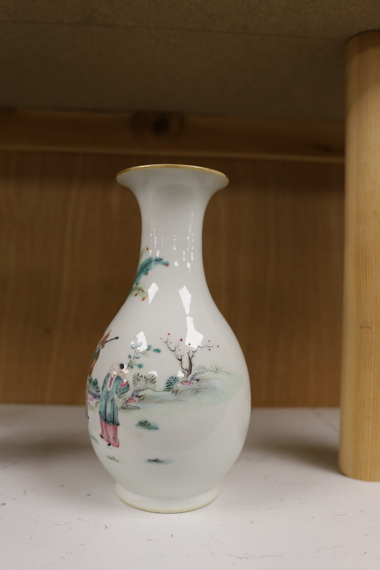 A Chinese porcelain famille rose vase, Qianlong red seal mark to the base, but early 20th century, 22cm high. Condition - good